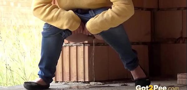  Blonde teen pisses on a building site to relieve pee desperation
